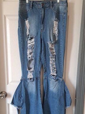 Distressed Light Blue Flare Jeans with Flounced Hem